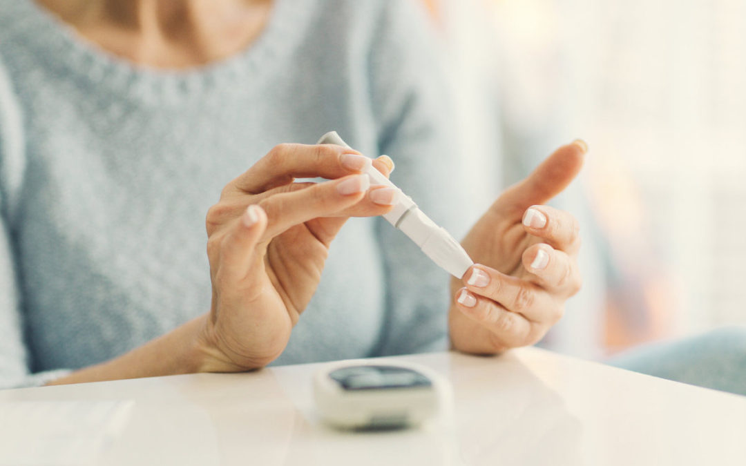 woman testing her glucose (diabetes)