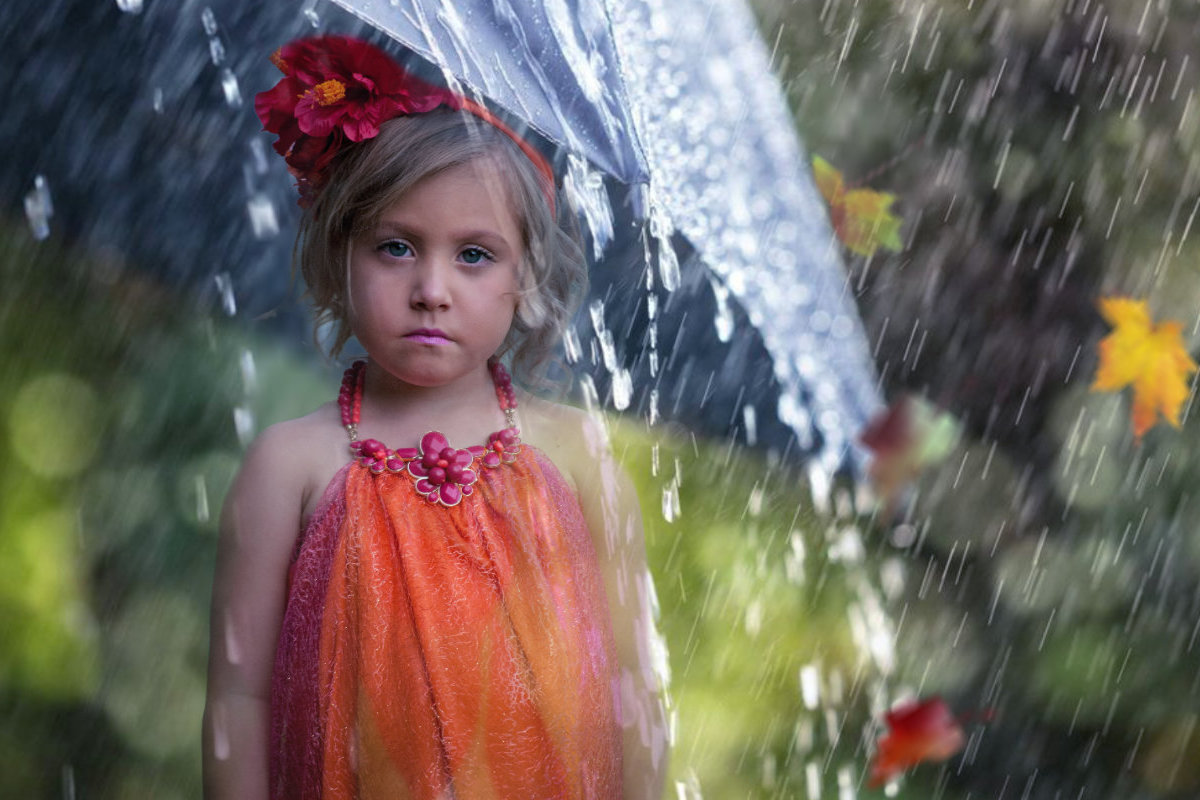 little girl sad under umbrella