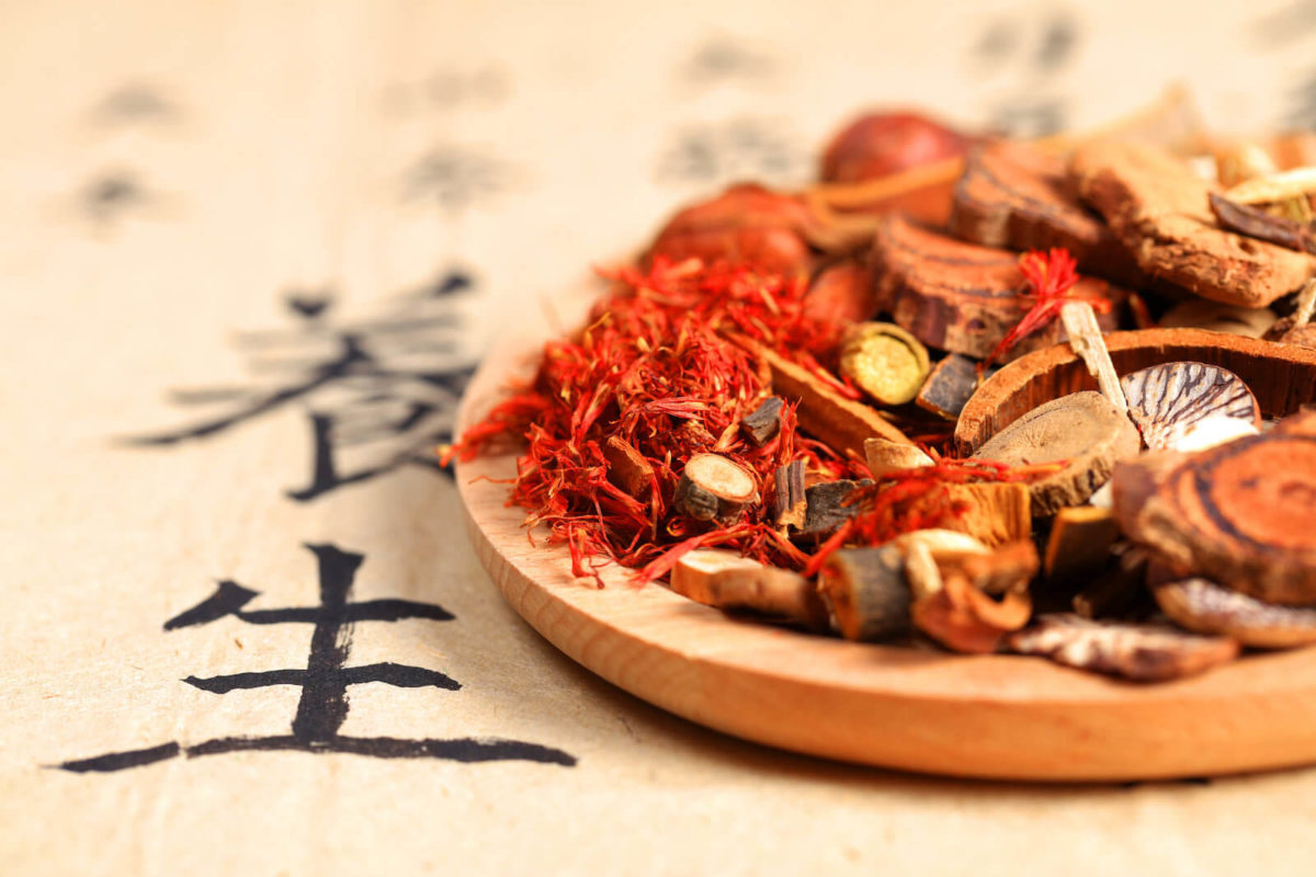 a wooden plate with chinese pharmacopea